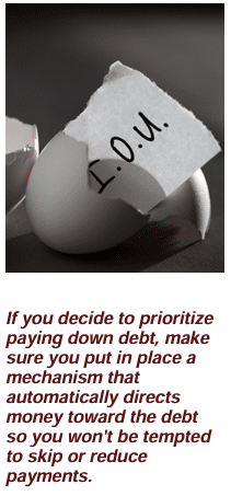 Image: A broken eggshell with a paper IOU. The text under the image is "If you decide to prioritize paying down debt, make sure you put in place a mechanism that automatically directs money toward the debt so you won't be tempted to skip or reduce payments." Article title: Pay Down Debt or Save for Retirement